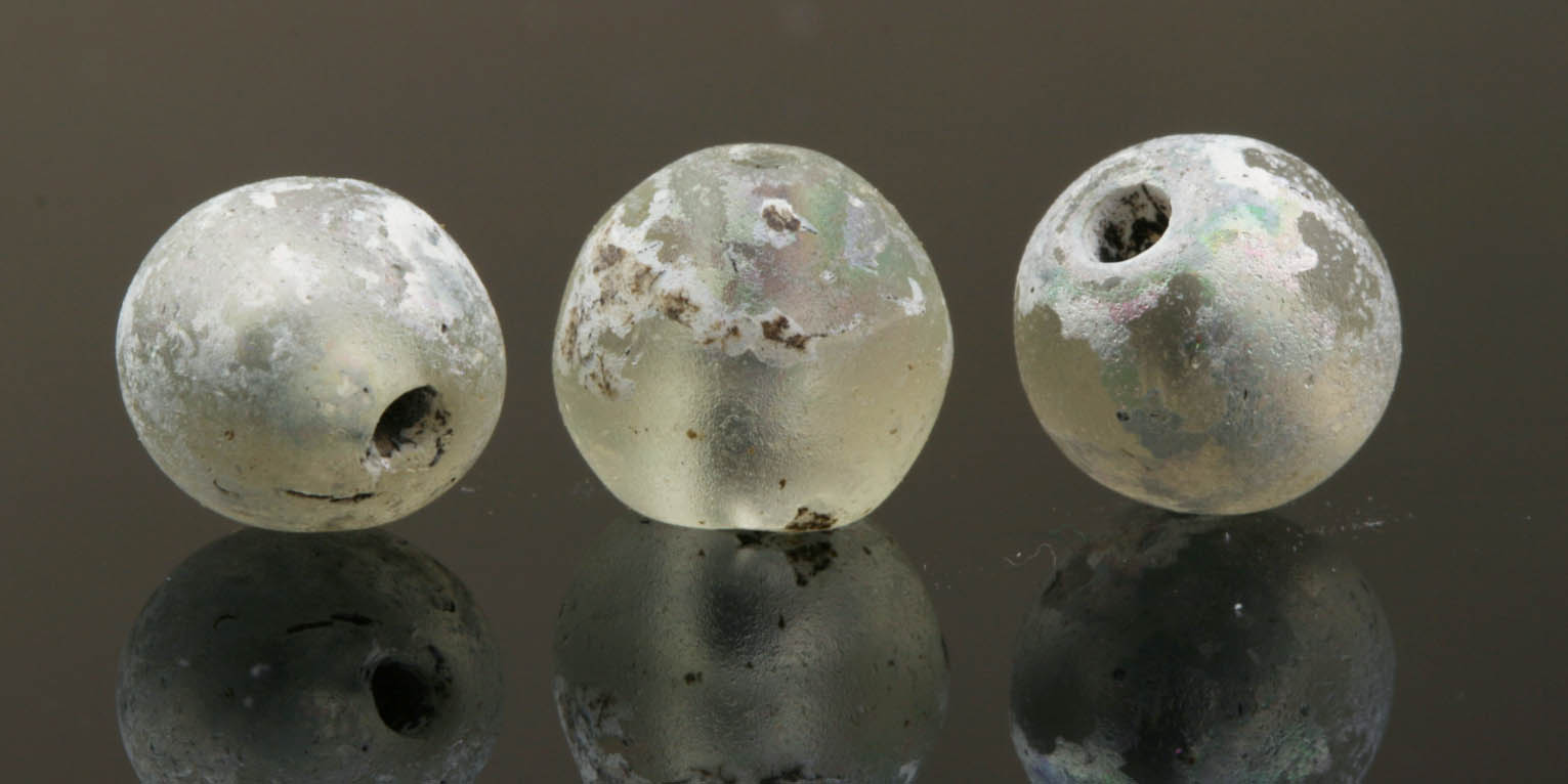 Three ancient iridescent monochrome glass beads 333MA
